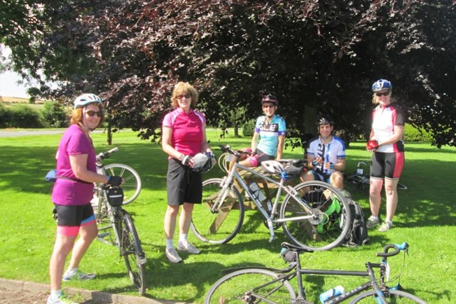 Cyclists relaxing at one of the refreshment points